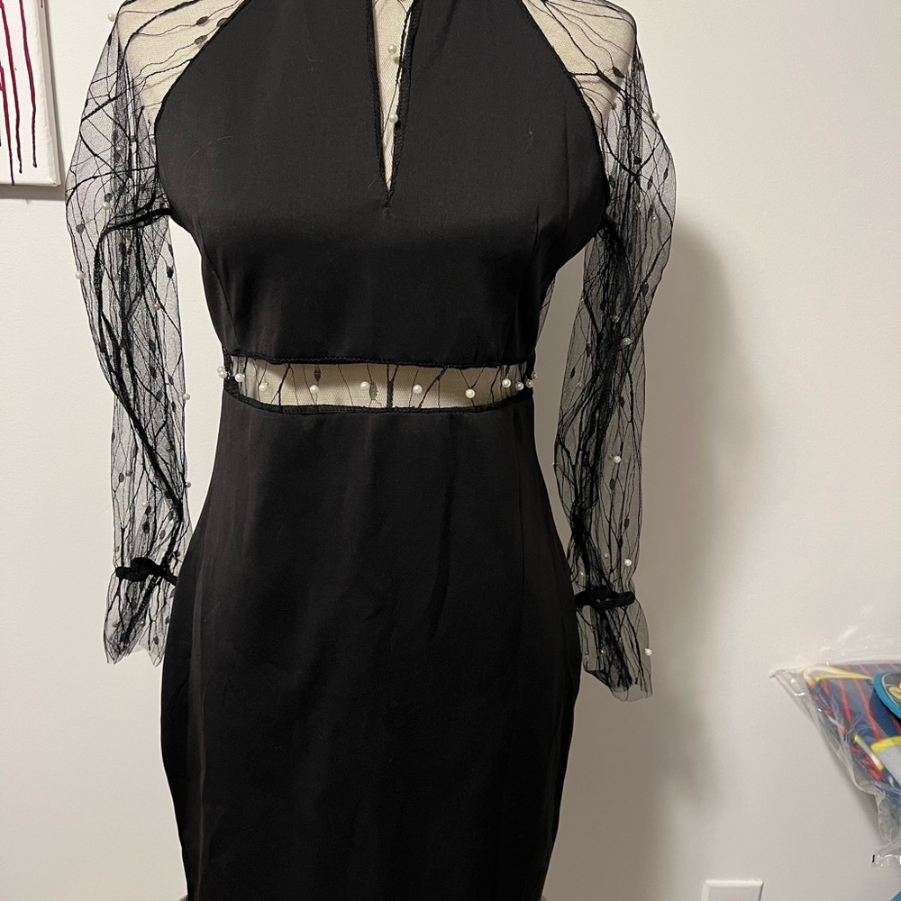 Little Black Dress size XL but runs small.